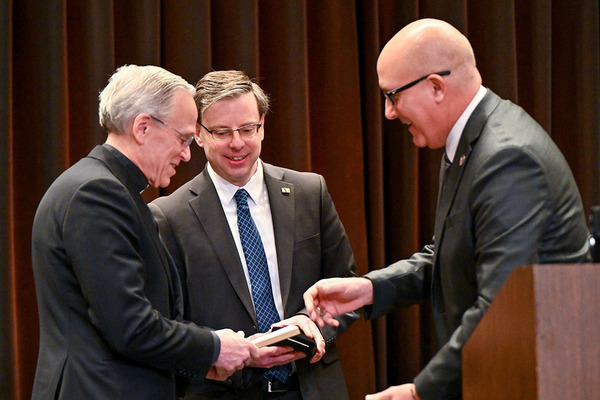 John I. Jenkins, on left, receiving keys to the cities of South Bend and Mishawka, presented by Mayors James Mueller, center, and Dave Wood on the right