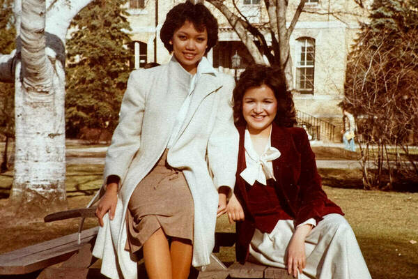 Cecilia Lucero, left, and a classmate pose for a photograph on campus in the early 1980s.